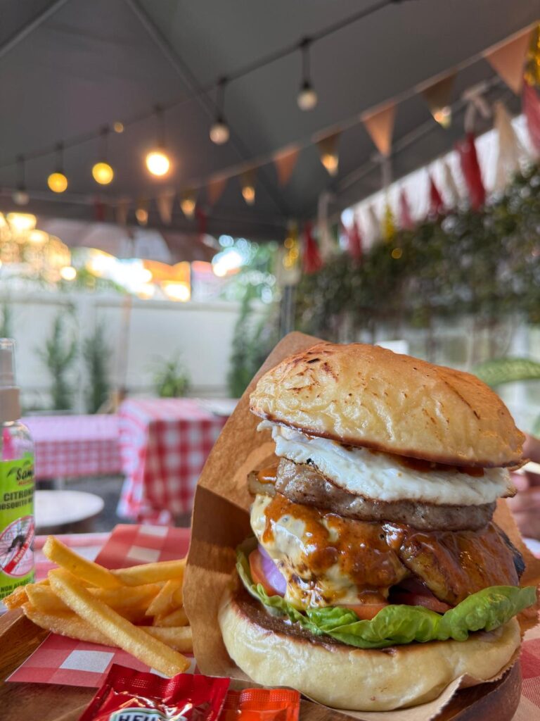 Hawaiian burger consisting of a special curry sauce over pork patty and served with a slice of pineapple;