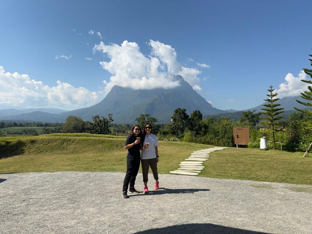 Majestic view of Doi Luang Chiang Dao mountain peak surrounded by lush greenery under a clear blue sky