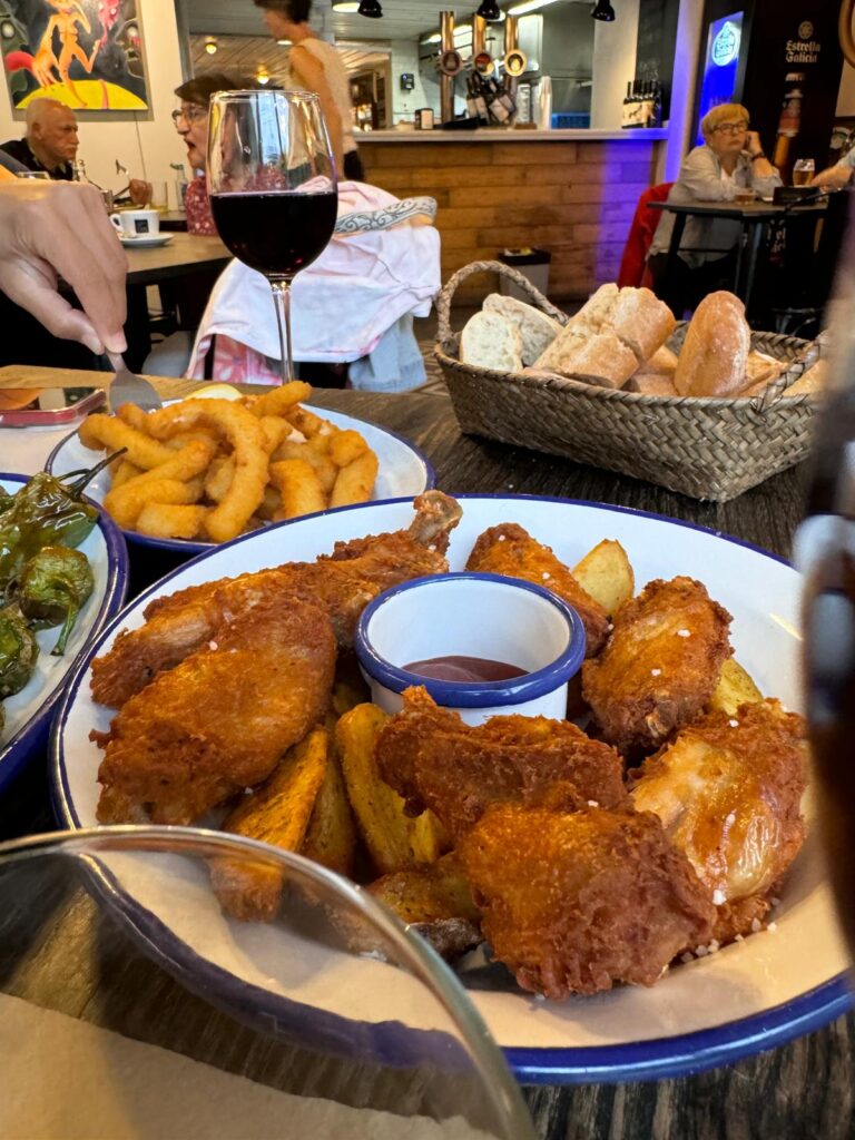 Crispy golden chicken wings served at La Droguería Bodega Jatetxea in Puente la Reina, Spain